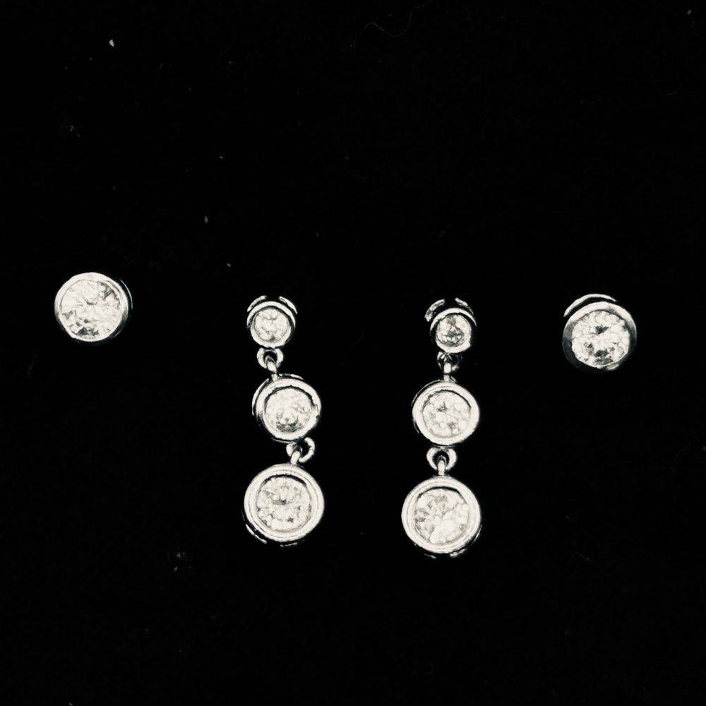 2 pairs of matching silver tone crystal earrings